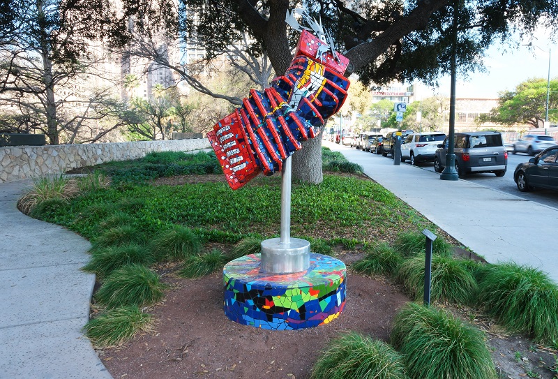 Gallery 2 - A sculpture of a colorful outstretched accordion looks as if it is ready to be played.